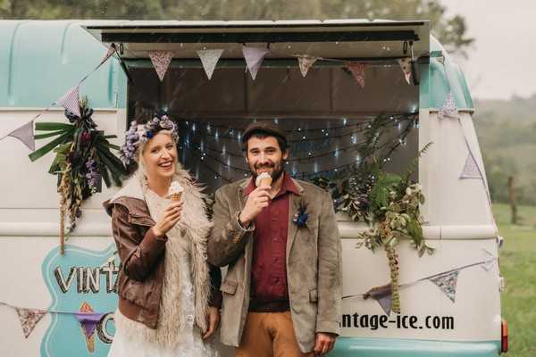 bride and groom eat icecream outside vintage icecream van