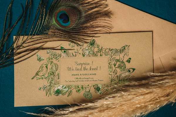 peacock feather and tea coloured wedding stationery