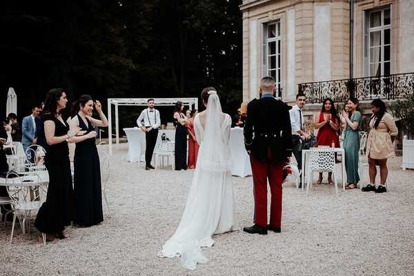 bride and groom arrive to their wedding reception at chateau santeny