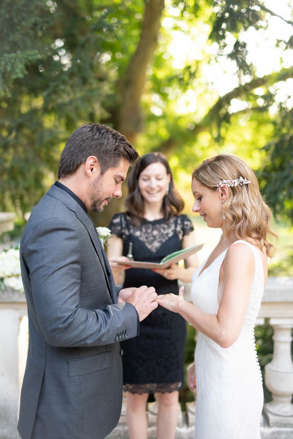 Bride and groom exchange rings 