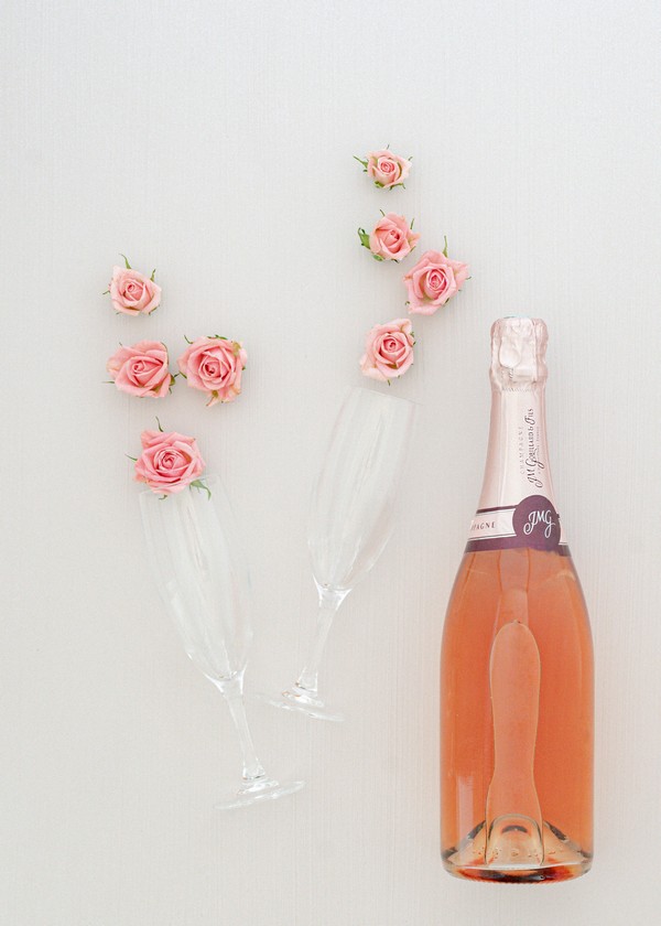 Flat Lay Photography rose bottle and glasses
