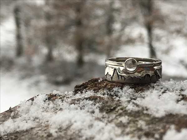 tailor-made wedding rings crafted by a local Chamonix artist made with a clear quartz crystal 