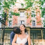 Newly weds hug in front of the facade of Chateau la Beaumetane