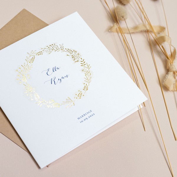 Folded card wedding invitation with gold foil design