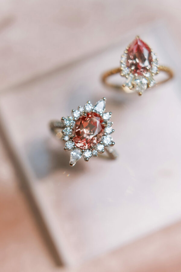 Artemis Peach Sapphire engagement rings in on a white cushion