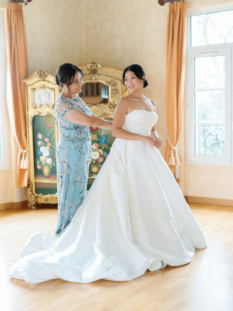 Domaine Mont Leuze CC Weddings bride mother getting ready putting strapless dress