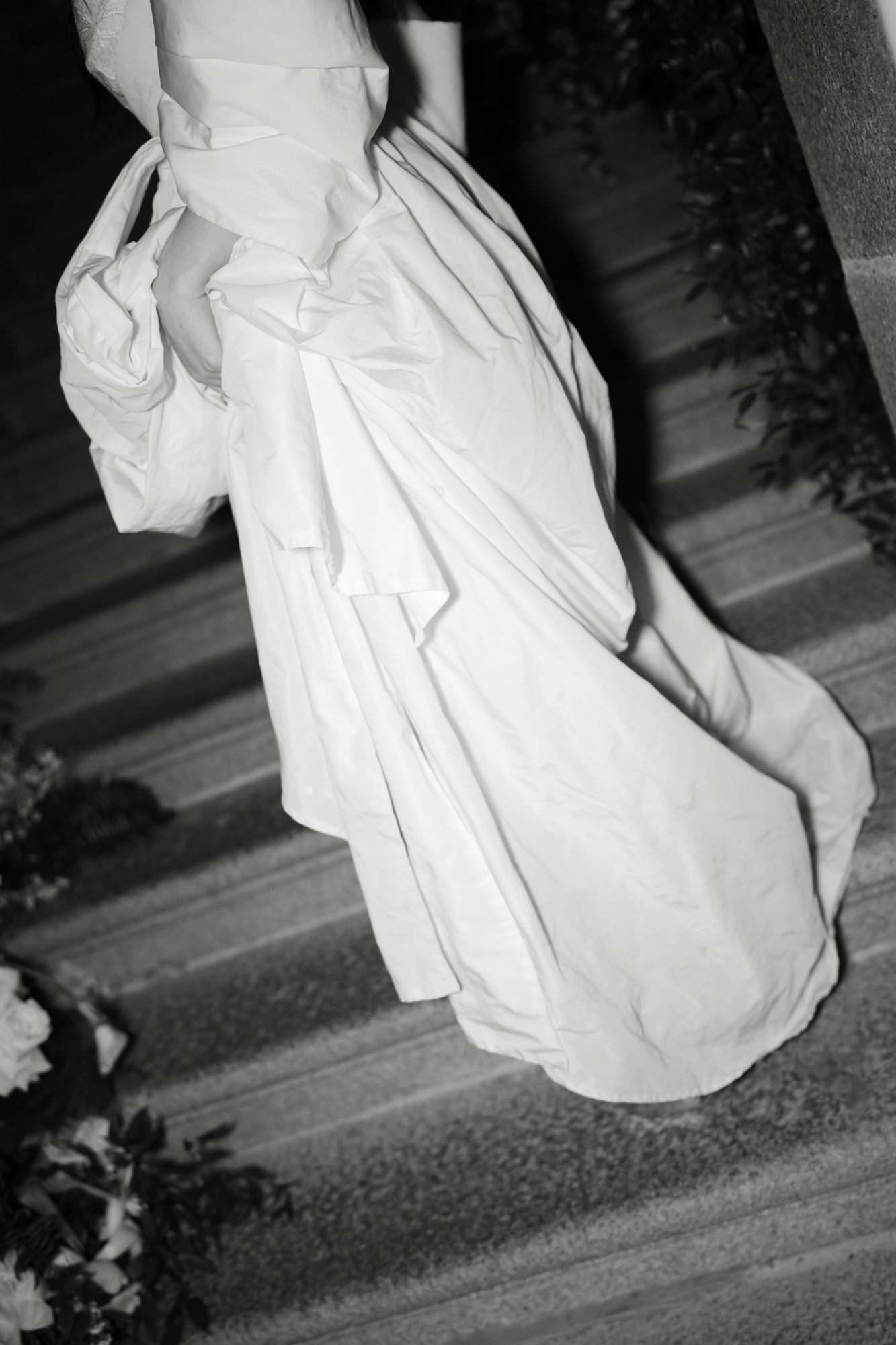 Bride and groom portrait on the causeway leading to Mont-Saint-Michel with sea views