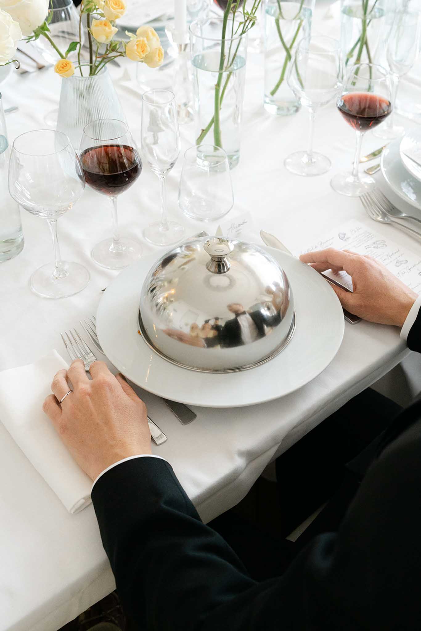 Outdoor ceremony at ChÃ¢teau de Garennes with guests seated in garden rows