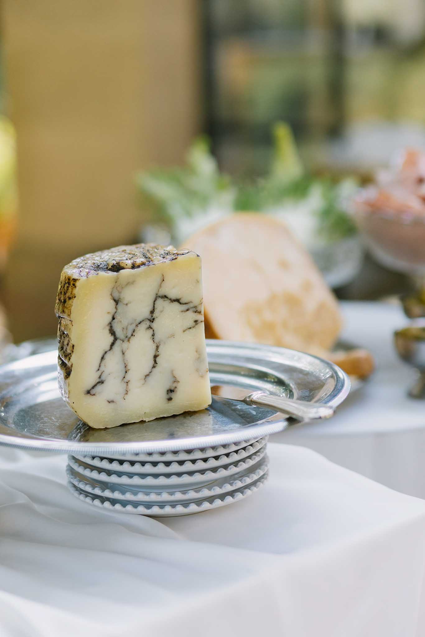 Blue cheese presented in silverware as canapÃ© detail at ChÃ¢teau de Fontareches wedding