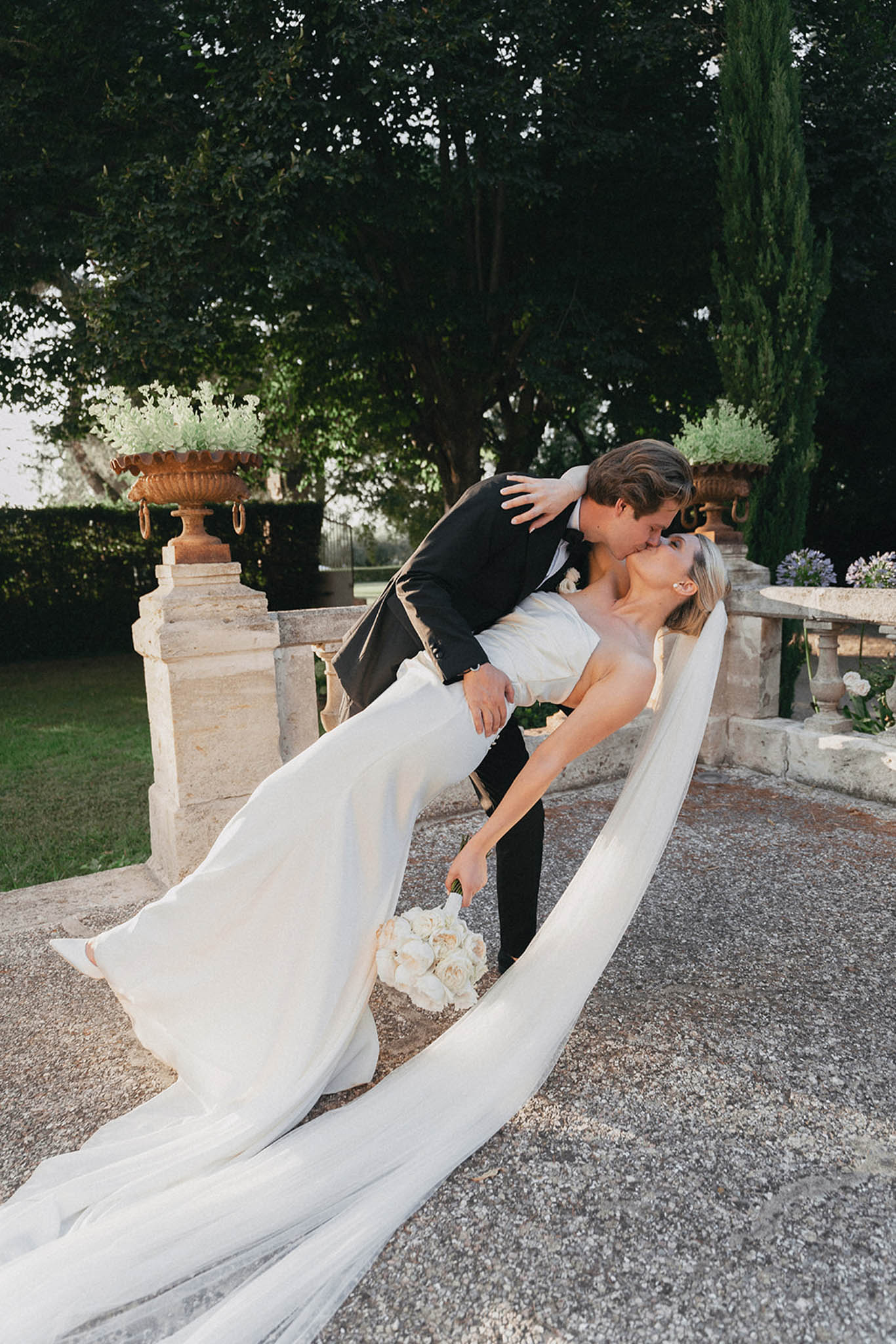 Bride and groom portrait in the gardens of Les Jardins de Campagne
