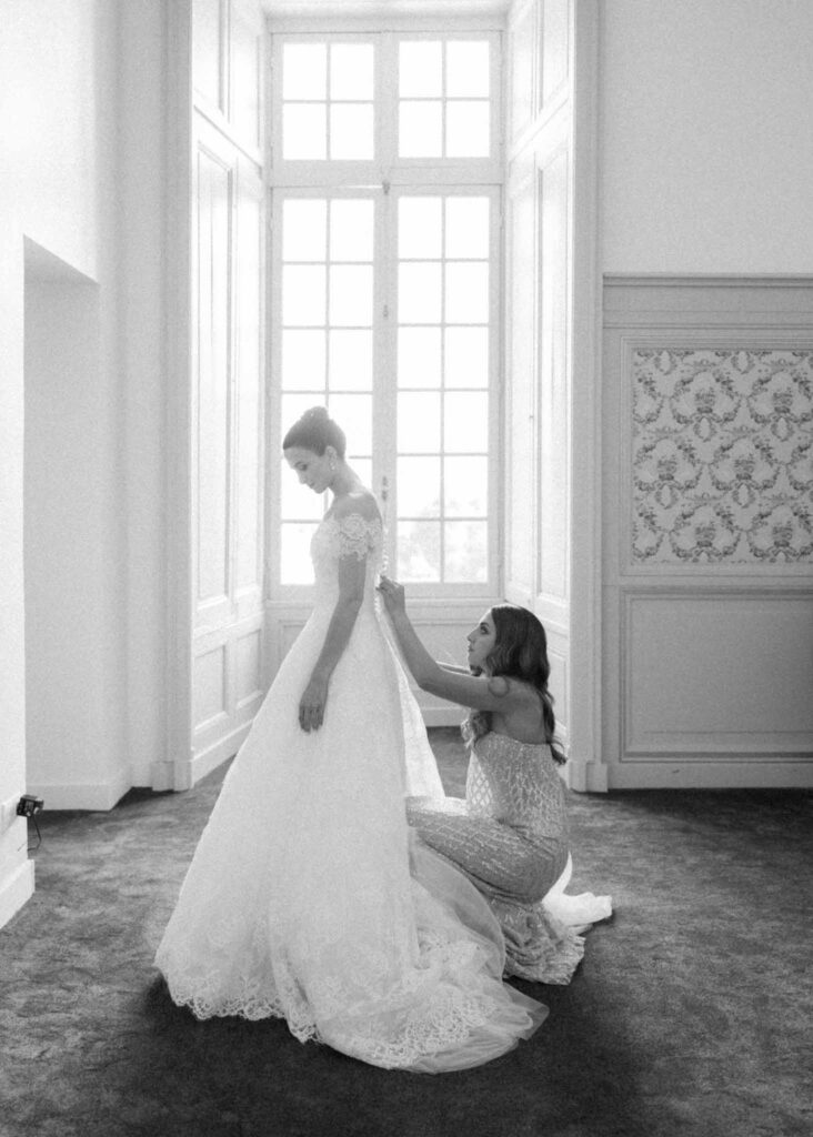 saint martin H.Clark bride assisted by bridesmaid black white photo