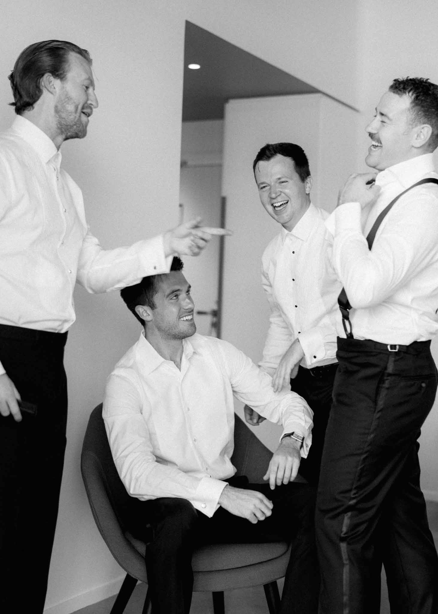 Groom and groomsmen getting ready before the wedding ceremony