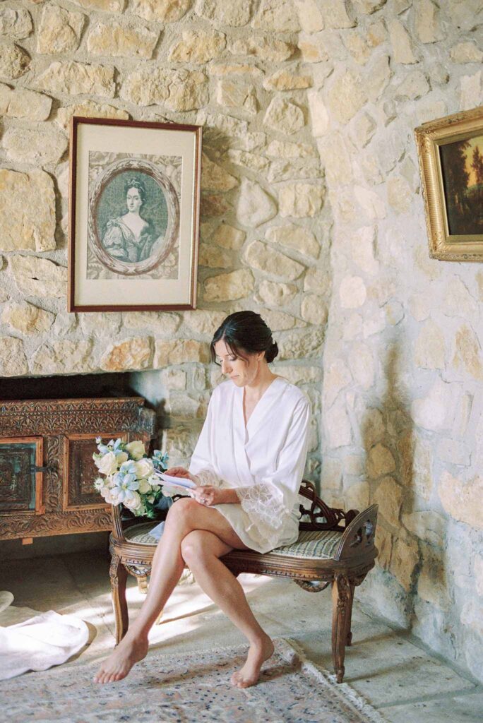 Chateau Cassis Olya bride getting ready sitting vintage chair reading