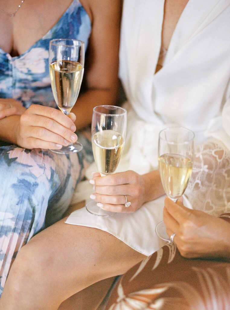 Chateau Cassis Olya detail shot bride bridesmaids holding champagne glass