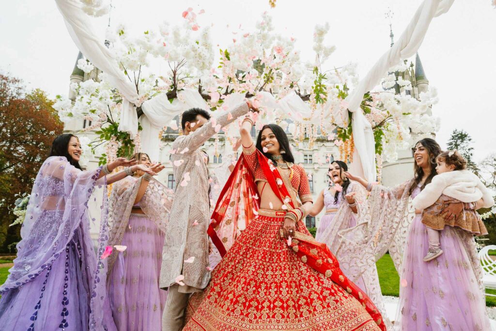 Chateau Challain F.Bandiera bride groom bridesmaids indian ceremony white flowers pink petals