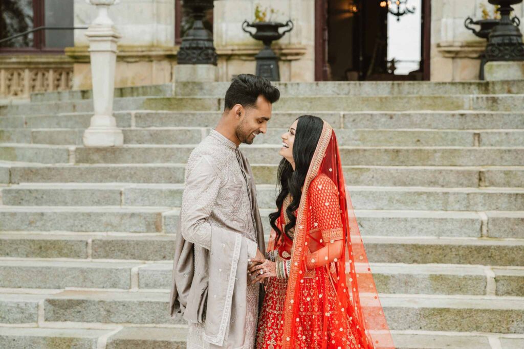 Chateau Challain F.Bandiera indian bride groom looking each other holding hands