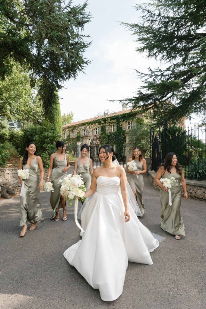 Domaine Mont Leuze CC Weddings bride bridesmaids formal shot outside vinatge gat walking