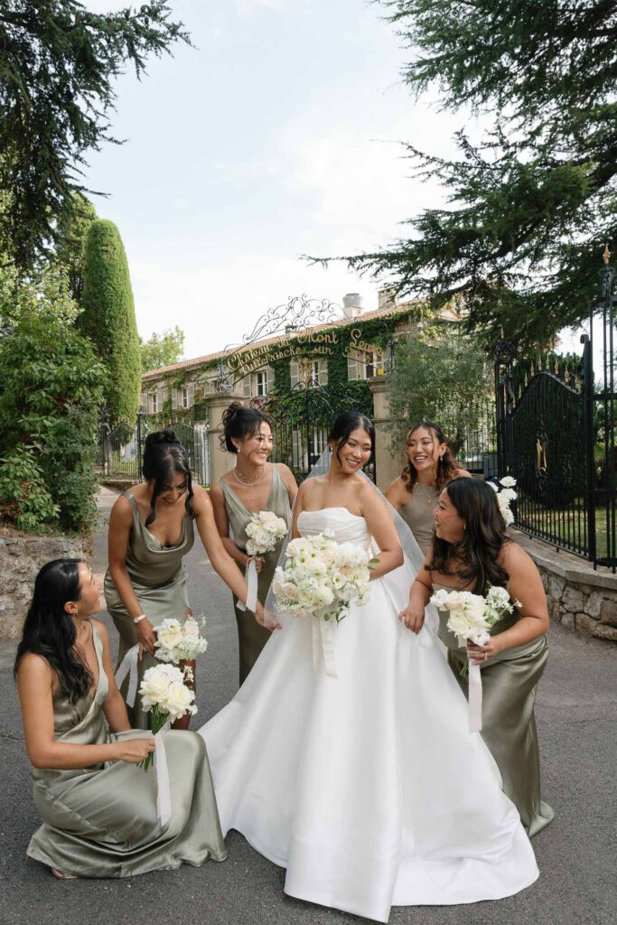 Domaine Mont Leuze CC Weddings bride bridesmaids formal shot outside vinatge gate candid