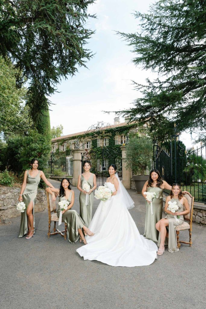 Domaine Mont Leuze CC Weddings bride bridesmaids formal shot outside vinatge gate sitting