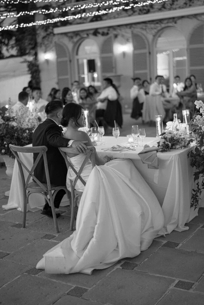 Domaine Mont Leuze CC Weddings bride groom hugging sitting reception black white photo