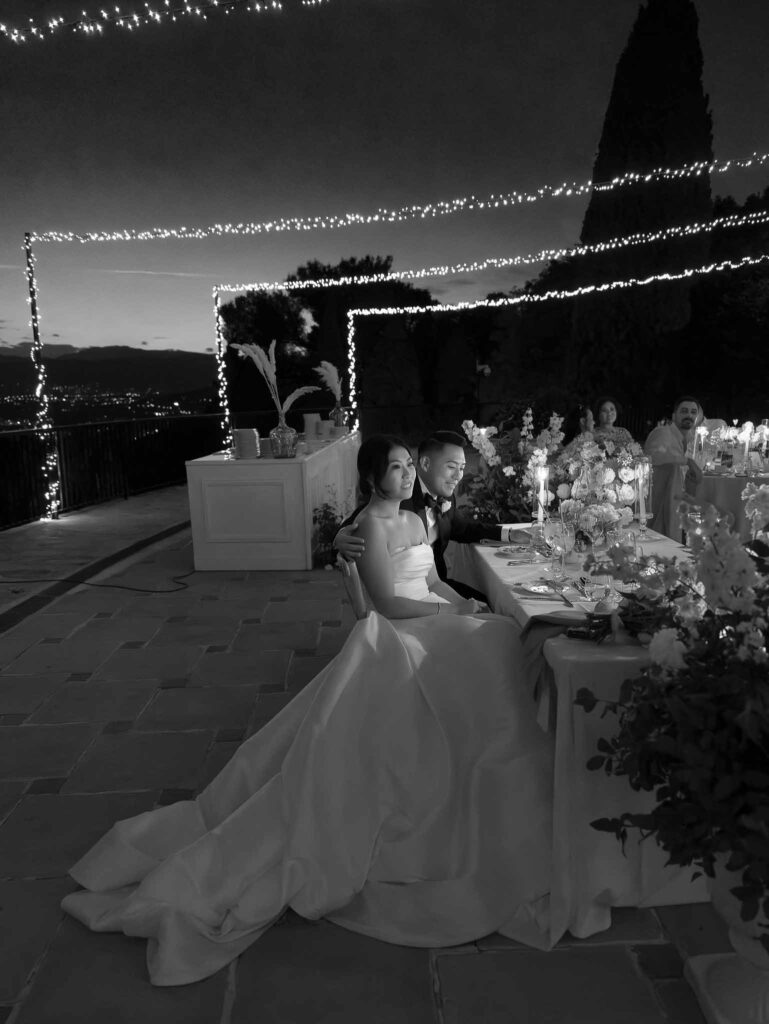 Domaine Mont Leuze CC Weddings bride groom hugging sitting reception black white photo overlooking view