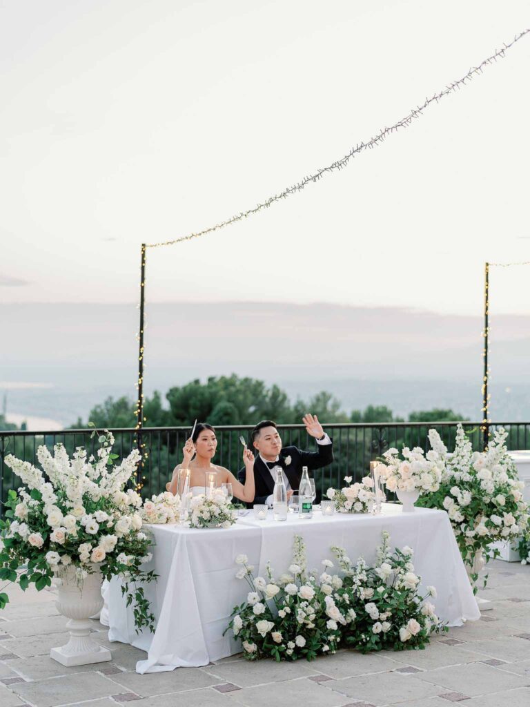 Domaine Mont Leuze CC Weddings bride groom sitting reception table overlookinf view