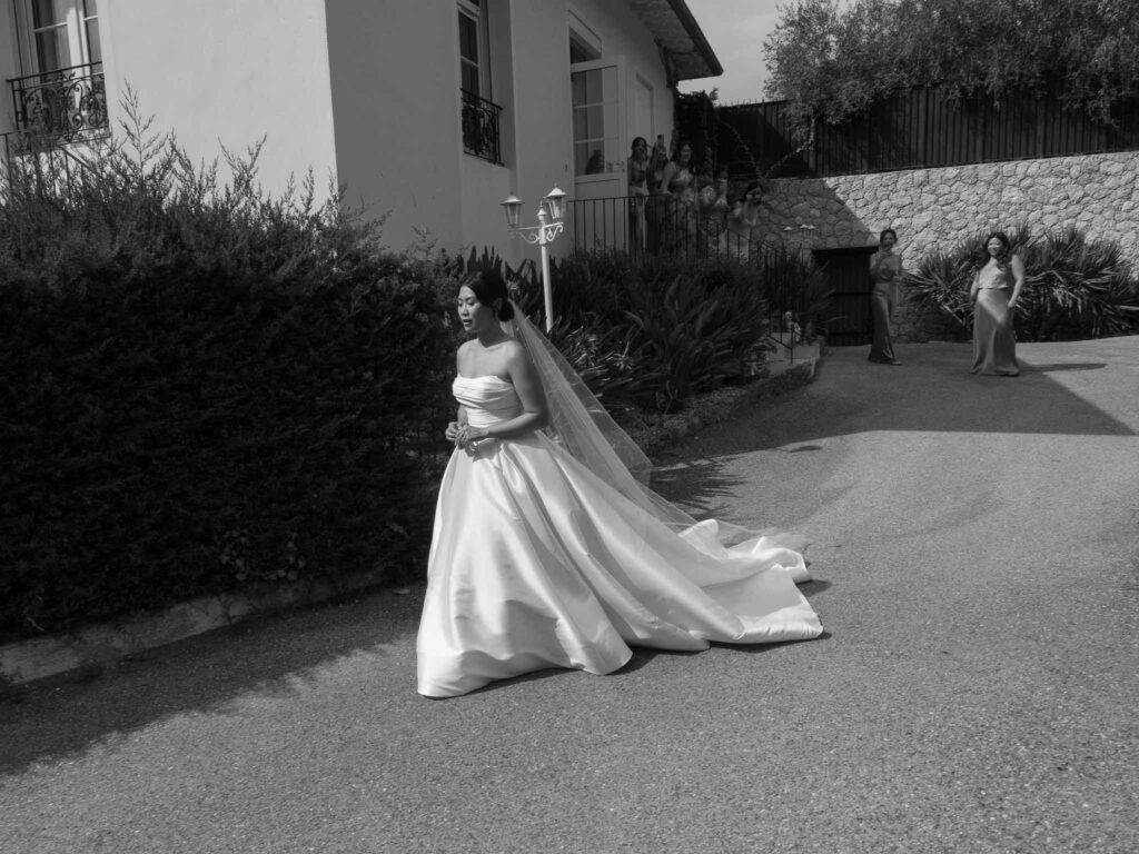 Domaine Mont Leuze CC Weddings bride walking strapless ball gown long veil black white photo