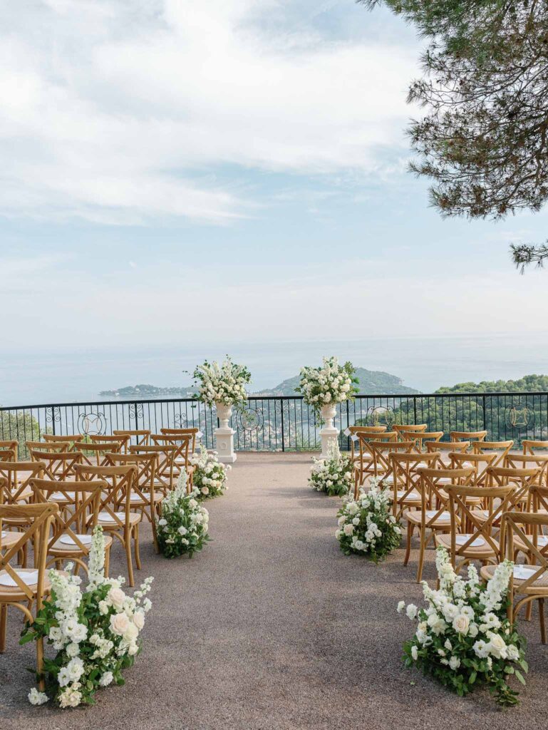 Domaine Mont Leuze CC Weddings ceremony area wood chairs two flower tower altar overlooking view