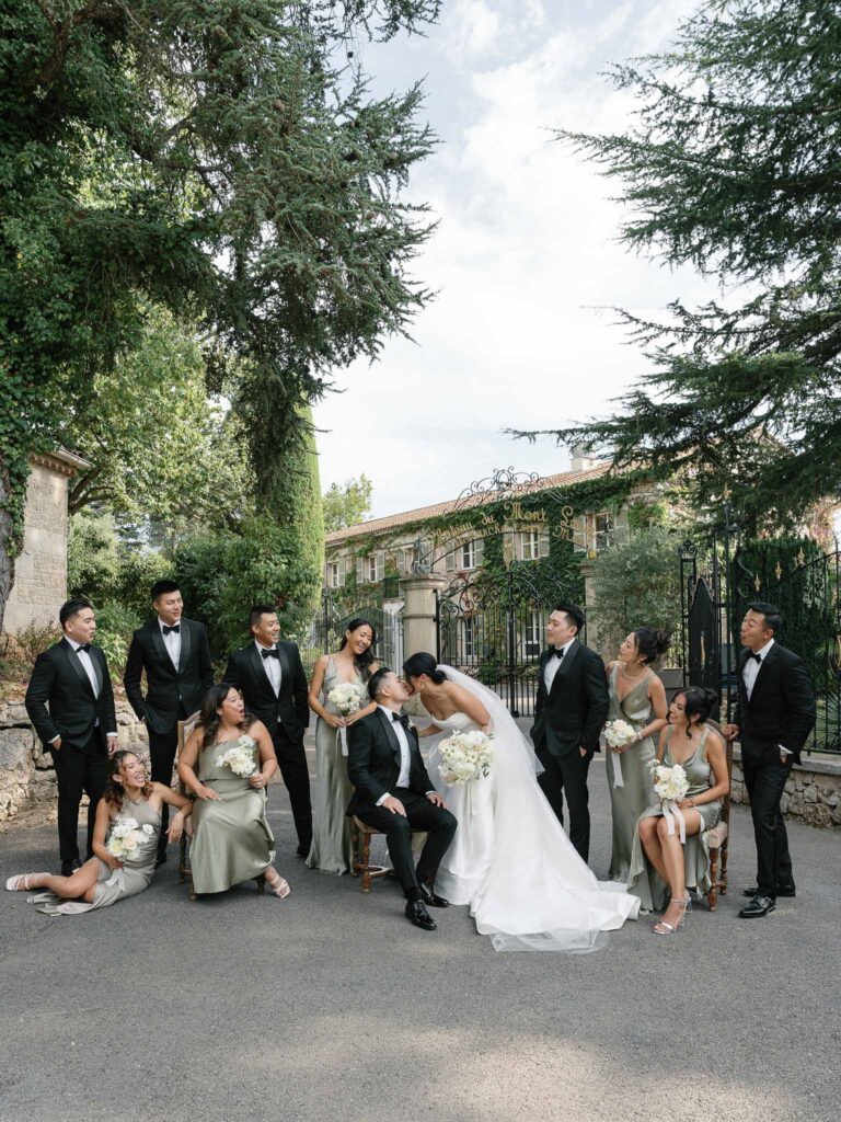 Domaine Mont Leuze CC Weddings couple entourage outside vinatge gate garden