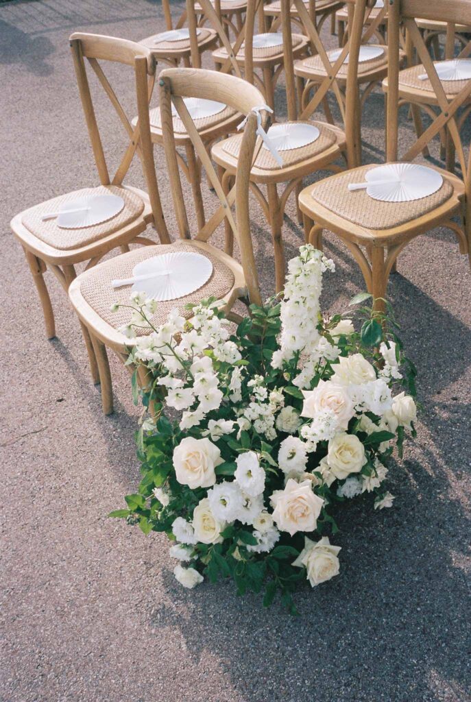 Domaine Mont Leuze CC Weddings film detail shot ceremony wood chairs white fan