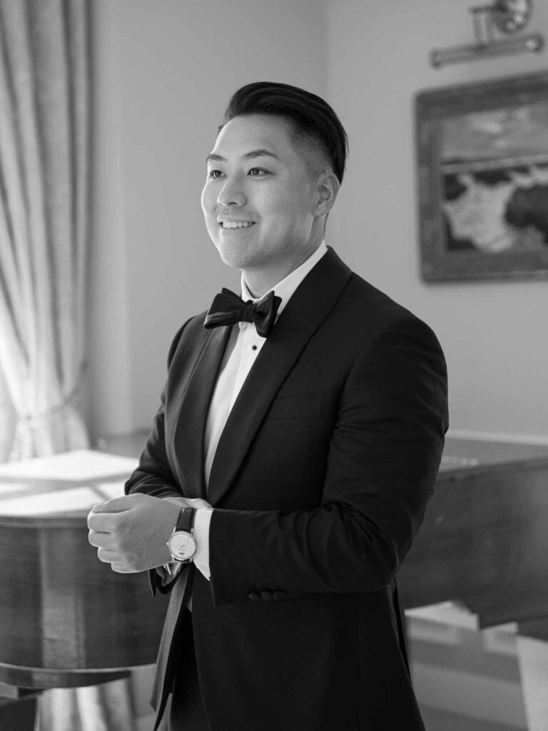 Domaine Mont Leuze CC Weddings groom getting ready fixing tux black white photo