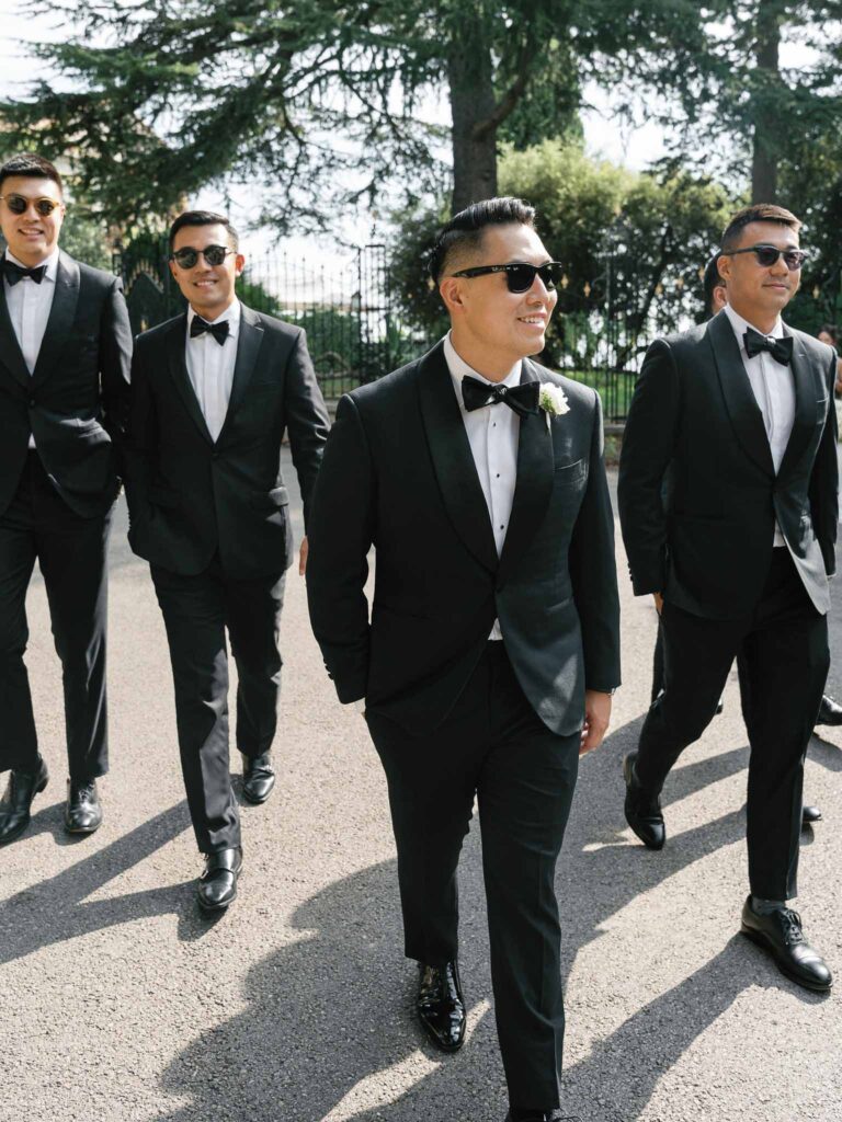 Domaine Mont Leuze CC Weddings groom groomsmen black shades walking
