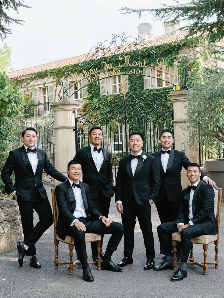 Domaine Mont Leuze CC Weddings groom groomsmen formal shot vintage gate outside