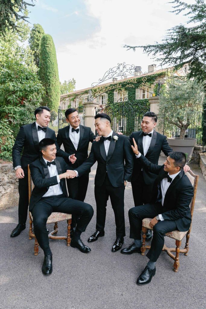 Domaine Mont Leuze CC Weddings groom groomsmen formal shot vintage gate outside candid