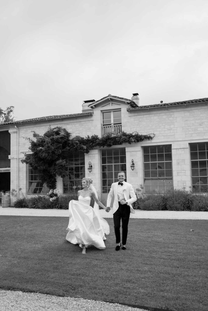 Gassies J.Flood bride groom running garden old vintage building background black white photo
