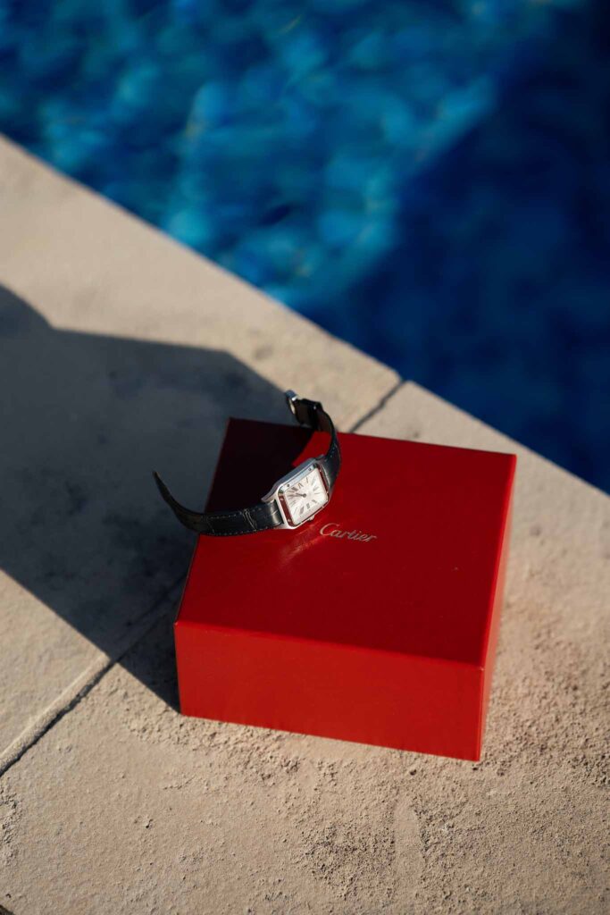 Gassies J.Flood detail shot cartier watch red box pool side