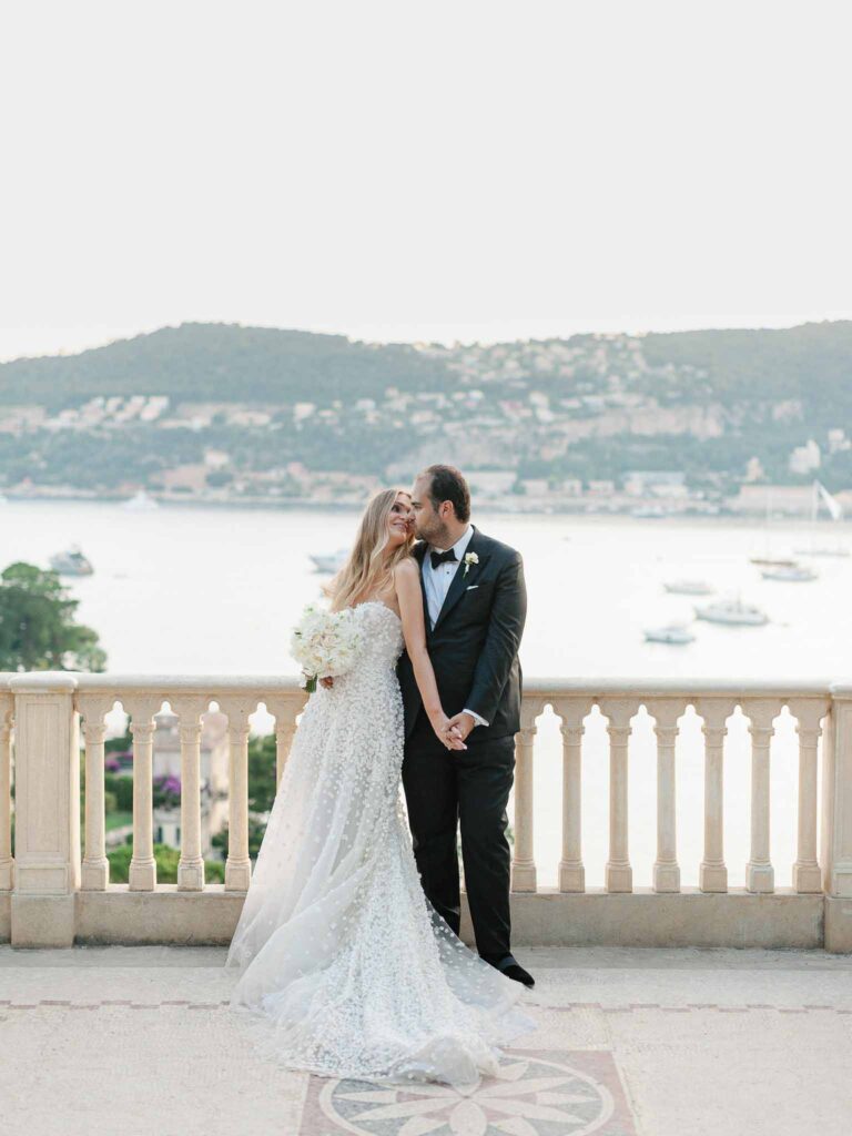 Villa Ehprussi Tatyana bride groom kissing hugging vintage balcony terrace overlooking sea mountain