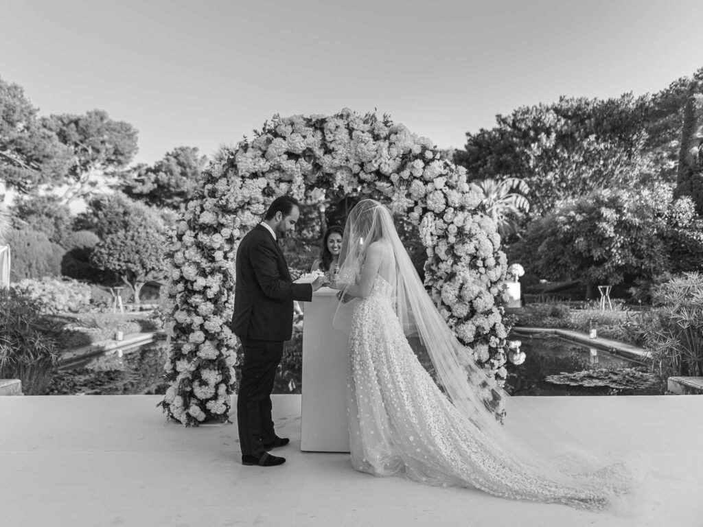 Villa Ehprussi Tatyana bride groom putting rings ceremony proper black white photo