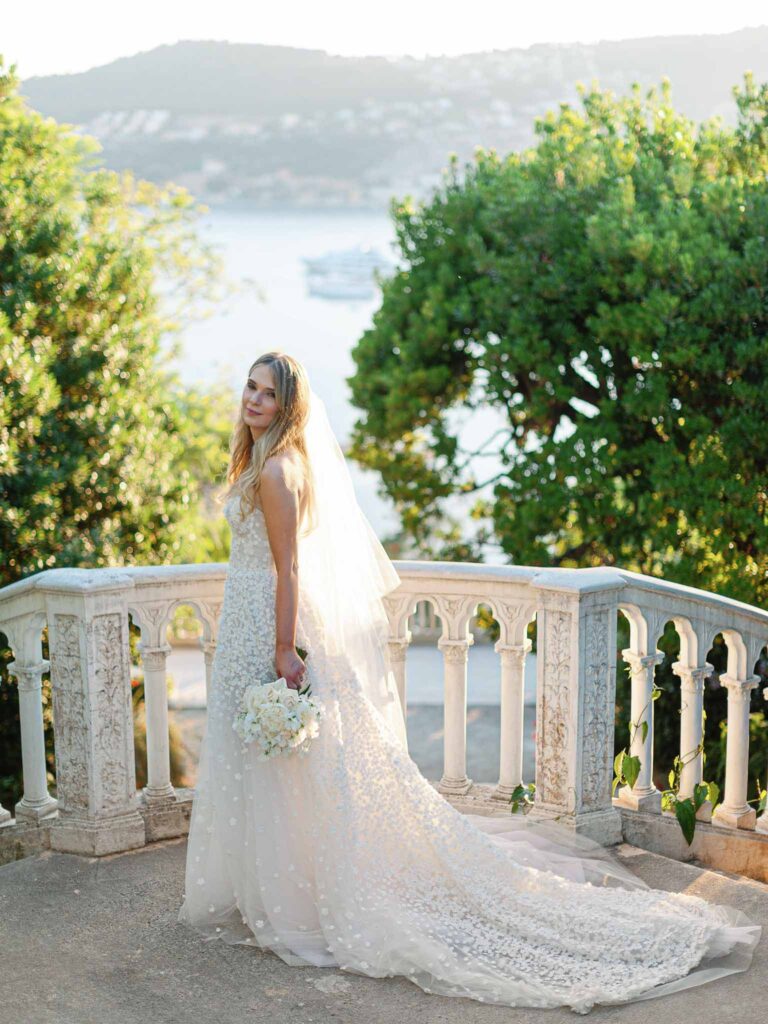 Villa Ehprussi Tatyana bride long strapless lace floral dress overlooking background