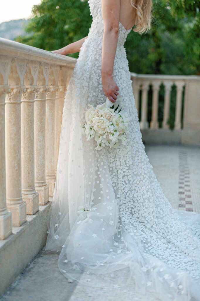 Villa Ehprussi Tatyana detail shot bride floral strapless dress holding bouquet
