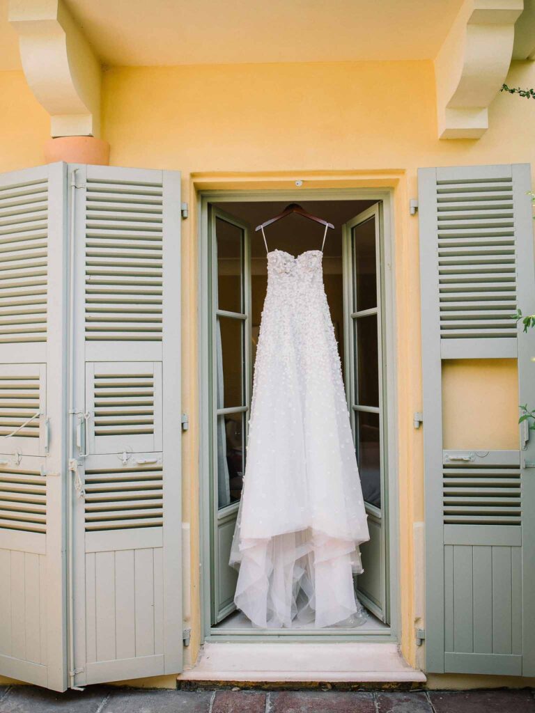 Villa Ehprussi Tatyana detail shot bride strapless floral lace dress hanging door