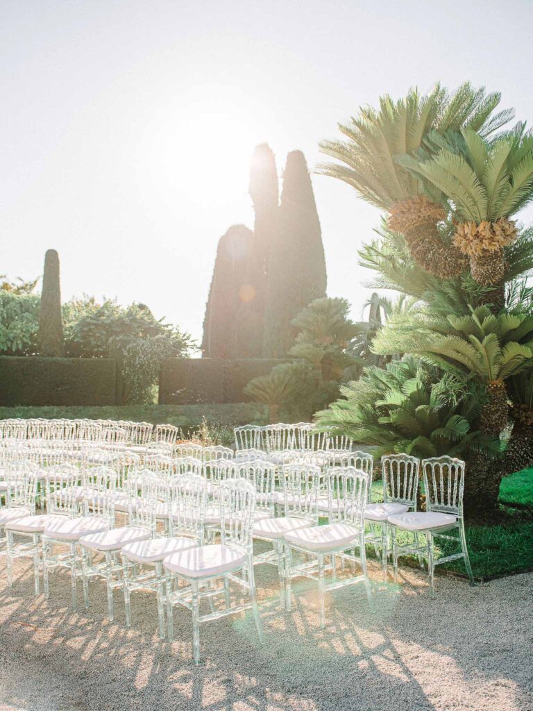 Villa Ehprussi Tatyana detail shot clear glass chair ceremony area garden sunlight