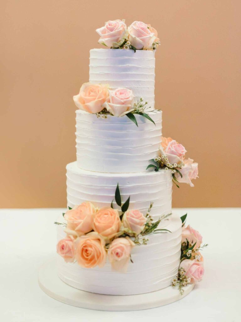 Villa Ehprussi Tatyana detail shot four tier white cake blush flower decor