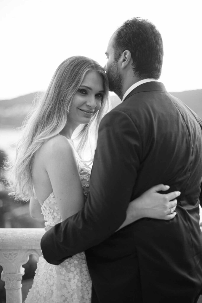 Villa Ehprussi Tatyana groom kissing bride head close up black white photo
