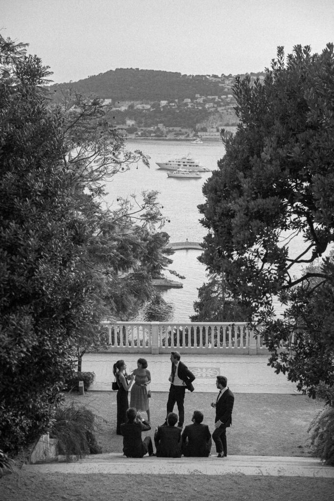 Villa Ehprussi Tatyana guests candid shot stairs overlooking view sea mountain black white photo