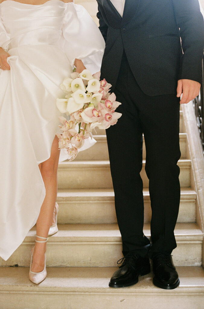 bride and groom focus on bridal bouquet