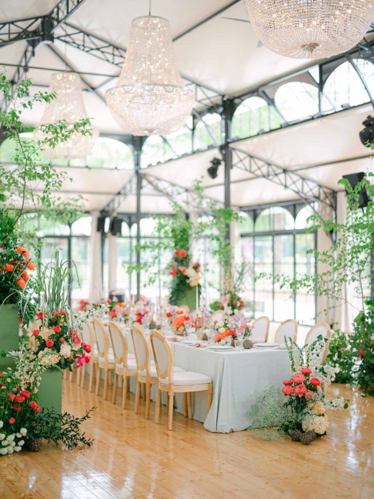 Château Belle Epoque Adeline Murzeau detail shot reception tent diamond chandelier colorful flowers arrangement