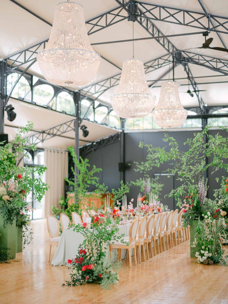 Château Belle Epoque Adeline Murzeau detail shot reception tent diamond chandelier colorful flowers long table