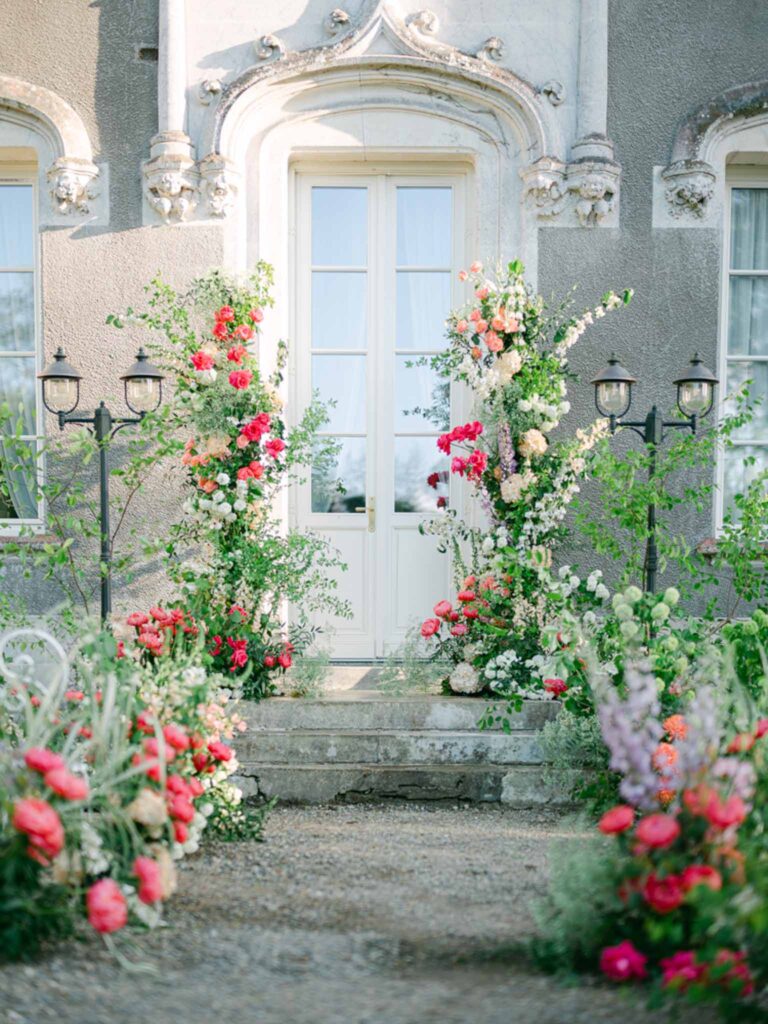 Château Belle Epoque Adeline Murzeau detail shot tropical flower arrangement ceremony aisle
