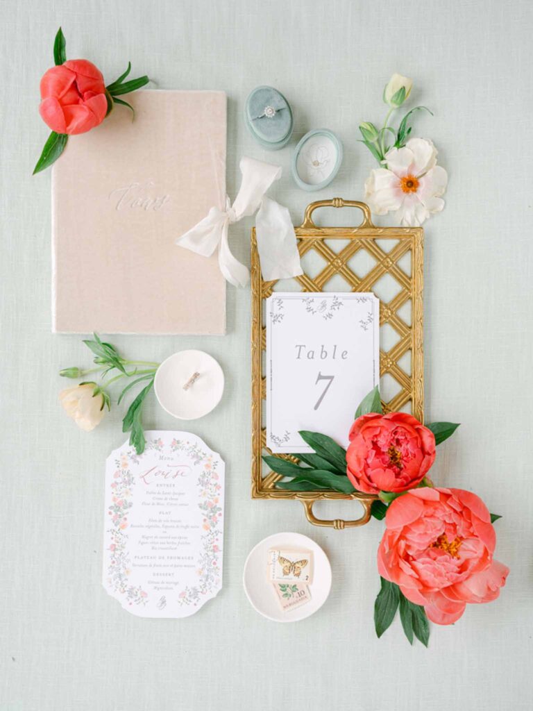Château Belle Epoque Adeline Murzeau flatlay invitation accessories tropical flower decor